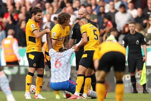 Paul Pogba of Manchester United interacts with Fabio Silva, Ruben Neves and Marcal of Wolverhampton Wanderers during the Premier League match between...