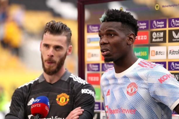 Paul Pogba of Manchester United is interviewed alongside team mate David De Gea following the Premier League match between Wolverhampton Wanderers...