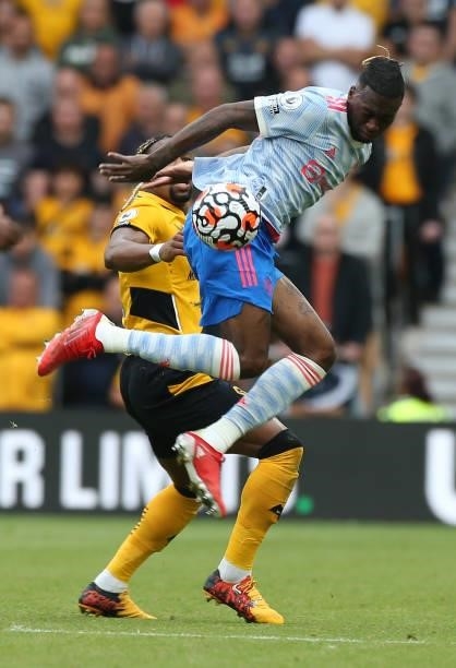 Aaron Wan-Bissaka of Manchester United in action with Adama Traore of Wolverhampton Wanderers during the Premier League match between Wolverhampton...