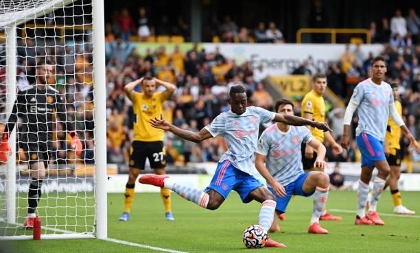 Aaron Wan-Bissaka of Manchester United clears the ball after a misssed chance by Romain Saiss of Wolverhampton Wanderers during the Premier League...