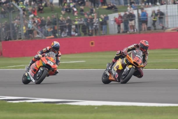 Augusto Fernandez of Spain and Elf Marc VDS Racing Team Lucio Nicastro of Italy leads Raul Fernandez of Spain and Red Bull KTM Ajo during the Moto2...