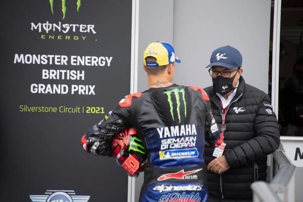 Fabio Quartararo of France and Monster Energy Yamaha MotoGP Team celebrates the victory with Carmelo Ezpeleta of Spain and Dorna CEO under the podium...