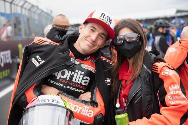 Aleix Espargaro of Spain and Aprilia Racing Team Gresini smiles with his wife on the grid during the MotoGP race during the MotoGP of Great Britain -...