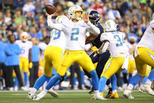 Easton Stick of the Los Angeles Chargers looks throw the ball in the third quarter during the NFL preseason game against the Seattle Seahawks at...