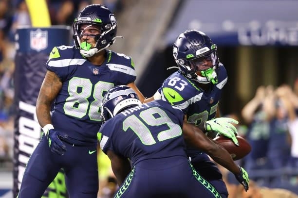 Darece Roberson Jr of the Seattle Seahawks celebrates after scoring a touchdown against the Los Angeles Chargers in the fourth quarter during the NFL...