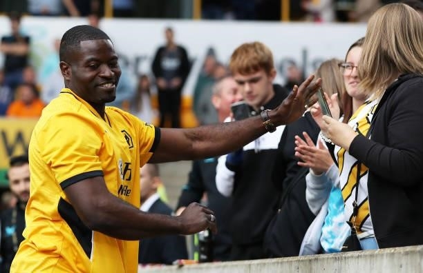 Former Wolverhampton Wanderers player, George Elokobi shows appreciation to the fans at half-time during the Premier League match between...