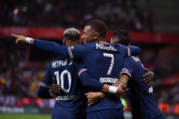 Kylian Mbappe of Paris Saint-Germain is congratulated by teammates Neymar Jr and Angel Di Maria after scoring during the Ligue 1 Uber Eats match...