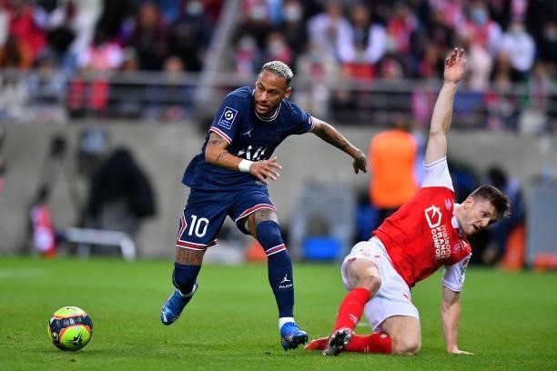 Neymar Jr of Paris Saint-Germain fights for possession during the Ligue 1 Uber Eats match between Reims and Paris Saint Germain at Stade Auguste...