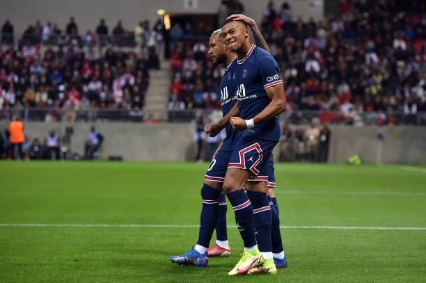 Kylian Mbappe of Paris Saint-Germain is congratulated by Neymar Jr after scoring during the Ligue 1 Uber Eats match between Reims and Paris Saint...