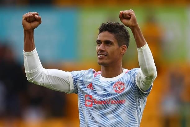 Raphael Varane of Manchester United celebrates at full-time following the Premier League match between Wolverhampton Wanderers and Manchester United...