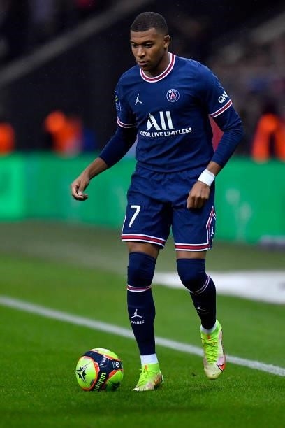 Kylian Mbappe of Paris Saint-Germain runs with the ball during the Ligue 1 Uber Eats match between Reims and Paris Saint Germain at Stade Auguste...