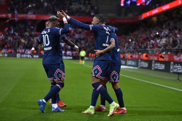 Kylian Mbappe of Paris Saint-Germain is congratulated by teammates after scoring during the Ligue 1 Uber Eats match between Reims and Paris Saint...