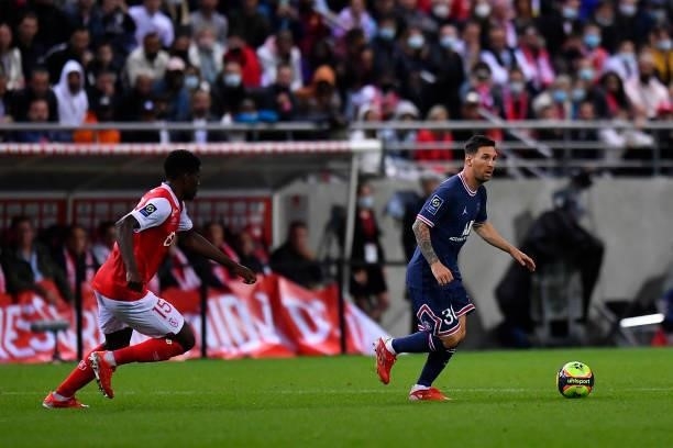 Lionel Messi of Paris Saint-Germain runs with the ball during the Ligue 1 Uber Eats match between Reims and Paris Saint Germain at Stade Auguste...