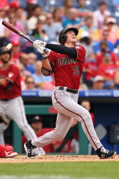 Jake McCarthy of the Arizona Diamondbacks hits an RBI double against the Philadelphia Phillies during the first inning of a game at Citizens Bank...