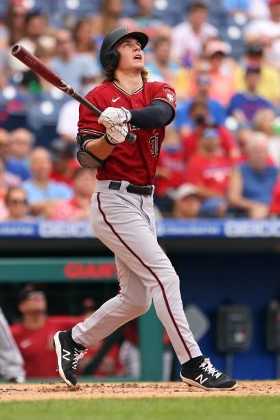 Jake McCarthy of the Arizona Diamondbacks hits an RBI double against the Philadelphia Phillies during the first inning of a game at Citizens Bank...
