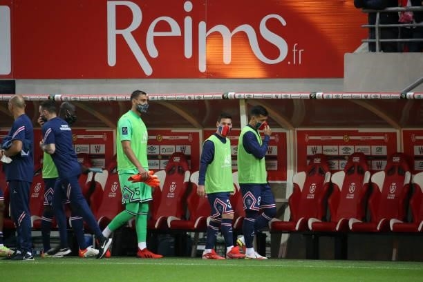Goalkeeper of PSG Gianluigi Donnarumma, Lionel Messi, Leandro Paredes of PSG enter the pitch to sit on the bench during the Ligue 1 Uber Eats match...