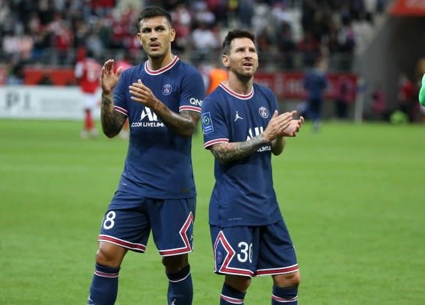 Lionel Messi, Leandro Paredes of PSG during the Ligue 1 Uber Eats match between Stade Reims and Paris Saint Germain at Stade Auguste Delaune on...