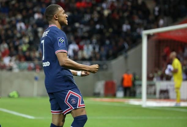Kylian Mbappe of PSG celebrates his first goal during the Ligue 1 Uber Eats match between Stade Reims and Paris Saint Germain at Stade Auguste...