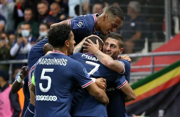 Kylian Mbappe of PSG celebrates his first goal with Marquinhos, Thilo Kehrer; Marco Verratti during the Ligue 1 Uber Eats match between Stade Reims...