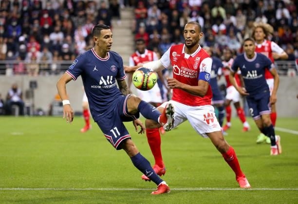 Angel Di Maria of PSG, Yunis Abdelhamid of Reims during the Ligue 1 Uber Eats match between Stade Reims and Paris Saint Germain at Stade Auguste...