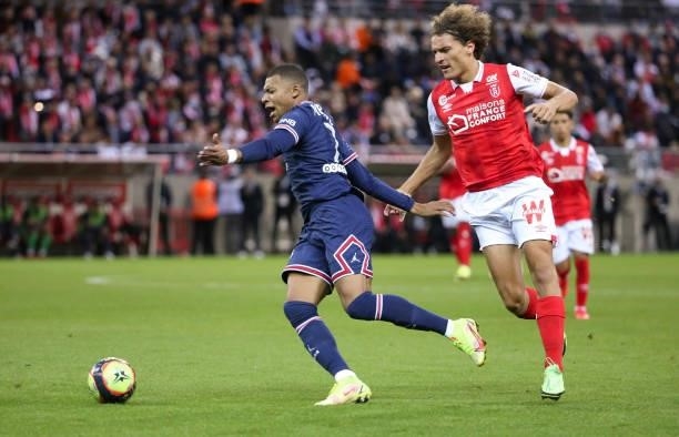 Kylian Mbappe of PSG, Wout Faes of Reims during the Ligue 1 Uber Eats match between Stade Reims and Paris Saint Germain at Stade Auguste Delaune on...