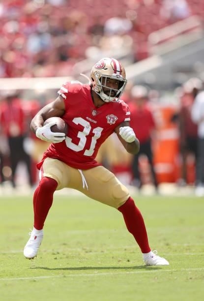 Raheem Mostert of the San Francisco 49ers runs with the ball during their preseason game against the Las Vegas Raiders at Levi's Stadium on August...
