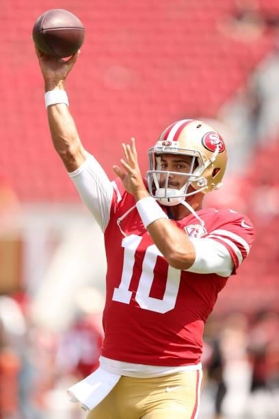 Jimmy Garoppolo of the San Francisco 49ers warms up before their preseason game against the Las Vegas Raiders at Levi's Stadium on August 29, 2021 in...