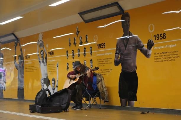 Busker is seen in an underpass outside Molineux prior to the Premier League match between Wolverhampton Wanderers and Manchester United at Molineux...