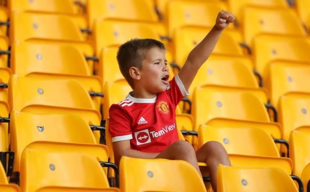 Young supporter of Manchester United shows his support prior to the Premier League match between Wolverhampton Wanderers and Manchester United at...
