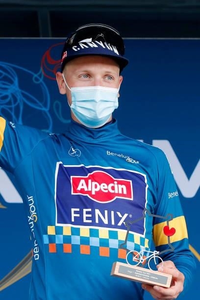 Tim Merlier of Belgium and Team Alpecin-Fenix celebrates winning the blue leader jersey on the podium ceremony after the 17th Benelux Tour 2021,...