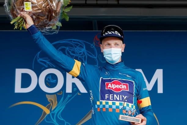 Tim Merlier of Belgium and Team Alpecin-Fenix celebrates winning the blue leader jersey on the podium ceremony after the 17th Benelux Tour 2021,...