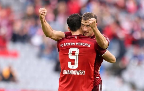 Robert Lewandowski of Bayern Muenchen celebrates as he scores the goal 1:0 with Leon Goretzka of Bayern Muenchen during the Bundesliga match between...