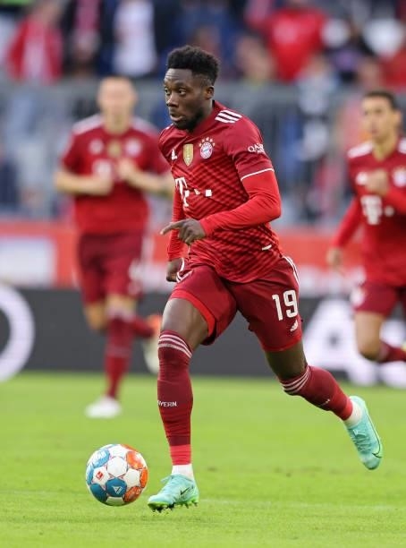 Alphonso Davies of Bayern Muenchen runs with the ball during the Bundesliga match between FC Bayern München and Hertha BSC at Allianz Arena on August...