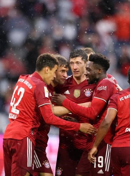 Thomas Mueller of Bayern Muenchen celebrates as he scores the goal 1:0 with Jamal Musiala of Bayern Muenchen Robert Lewandowski of Bayern Muenchen...