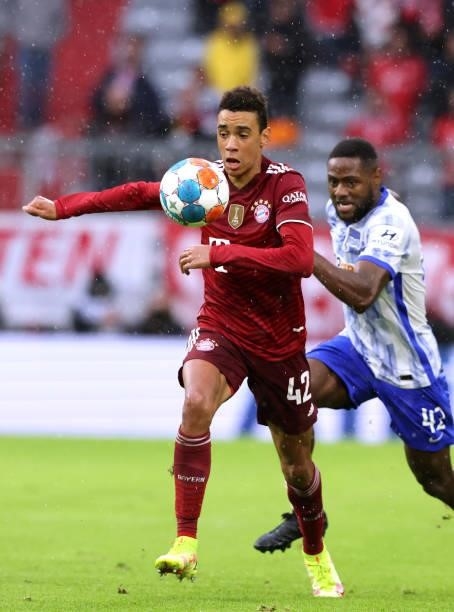 Jamal Musiala of Bayern Muenchen runs with the ball during the Bundesliga match between FC Bayern München and Hertha BSC at Allianz Arena on August...