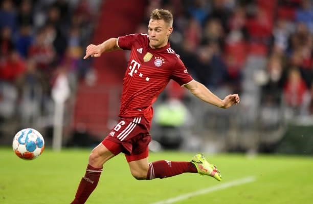 Joshua Kimmich of Bayern Muenchen runs with the ball during the Bundesliga match between FC Bayern München and Hertha BSC at Allianz Arena on August...