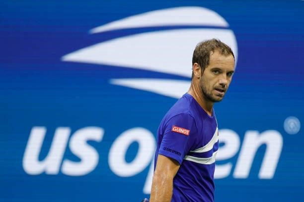Richard Gasquet of France looks on as he plays against Daniil Medvedev of Russia during their Men's Singles first round match on Day One of the 2021...