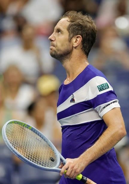 Richard Gasquet of France reacts against Daniil Medvedev of Russia during their Men's Singles first round match on Day One of the 2021 US Open at the...