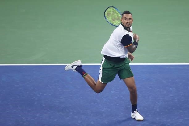 Nick Kyrgios of Australia returns the ball against Roberto Bautista Agut of Spain during their Men's Singles first round match on Day One of the 2021...