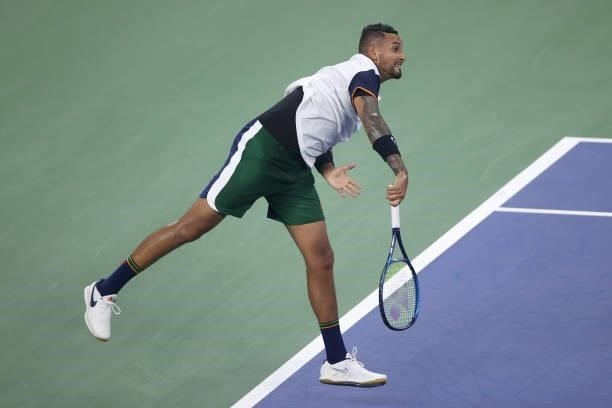 Nick Kyrgios of Australia serves the ball against Roberto Bautista Agut of Spain during their Men's Singles first round match on Day One of the 2021...