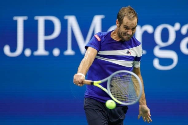 Richard Gasquet of France returns the ball against Daniil Medvedev of Russia during their Men's Singles first round match on Day One of the 2021 US...