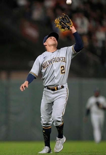 Luis Urias of the Milwaukee Brewers catches a pop-up off the bat of Alex Dickerson of the San Francisco Giants in the bottom of the seventh inning at...