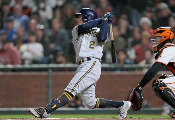 Luis Urias of the Milwaukee Brewers hits a sacrifice fly scoring Omar Narvaez against the San Francisco Giants in the top of the eighth inning at...