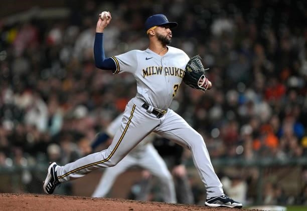 Devin Williams of the Milwaukee Brewers pitches against the San Francisco Giants in the bottom of the eighth inning at Oracle Park on August 30, 2021...