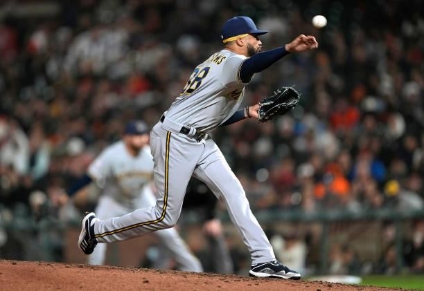 Devin Williams of the Milwaukee Brewers pitches against the San Francisco Giants in the bottom of the eighth inning at Oracle Park on August 30, 2021...