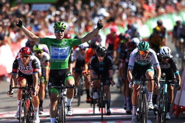 Fabio Jakobsen of Netherlands and Team Deceuninck - Quick-Step Green Points Jersey celebrates at finish line as stage winner ahead of Matteo Trentin...