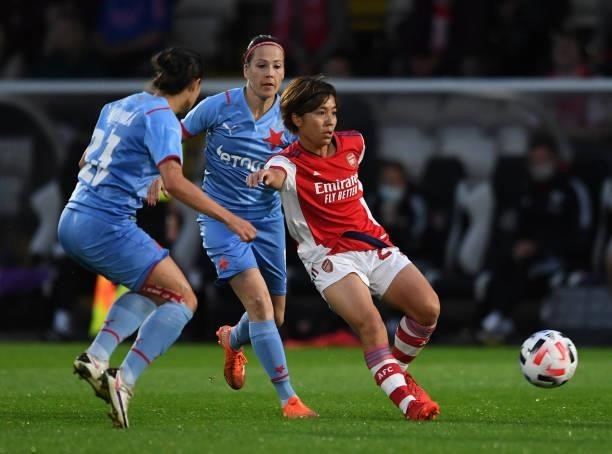 Mana Iwabuchi of Arsenal passes the ball under pressure from Michaela Khyrova and Martina Surnovska of Slavia Prague during the UEFA Women's...