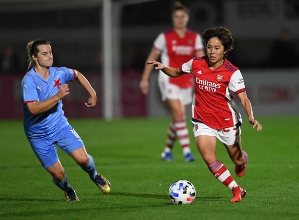 Mana Iwabuchi of Arsenal is challenged by Tereza Szewieczkova of Slavia Prague during the UEFA Women's Champions League match between Arsenal Women...