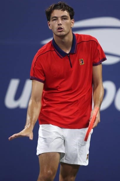 Taylor Fritz of the United States reacts against Alex de Minaur of Australia during his Men's Singles first round match on Day Two of the 2021 US...