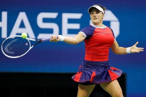 Bianca Andreescu of Canada returns a shot against Viktorija Golubic of Switzerland during her Women's Singles first round match on Day Two of the...